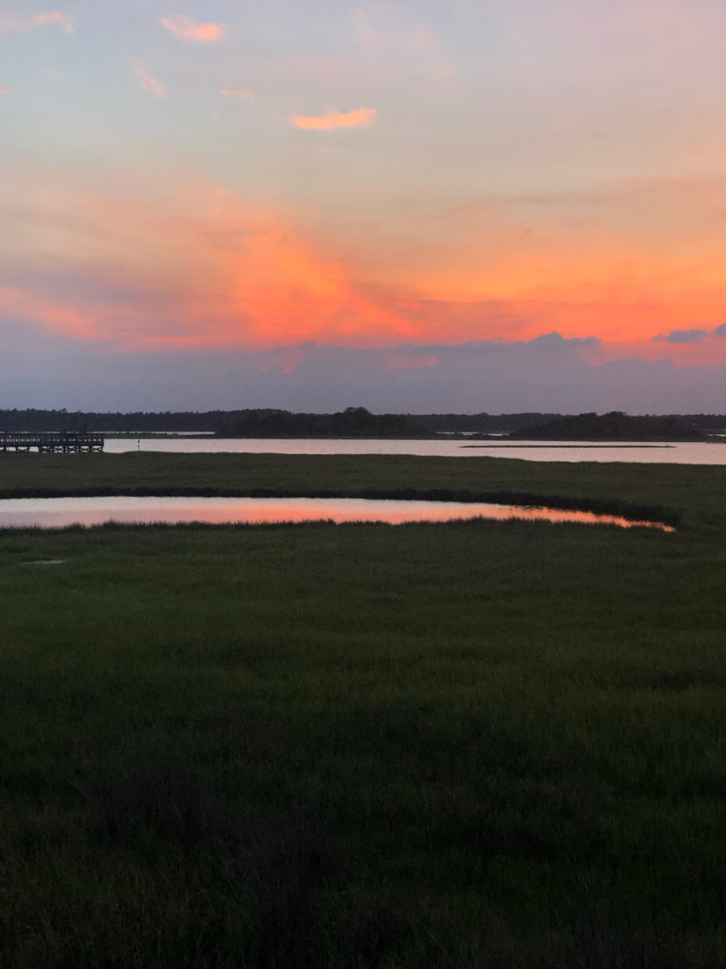 Pink and orange sunset over the Topsail sound and marsh